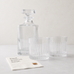 Clear eco-crystal Regent decanter and two double old fashioned glasses with "Dad, you're neat" cocktail napkins.