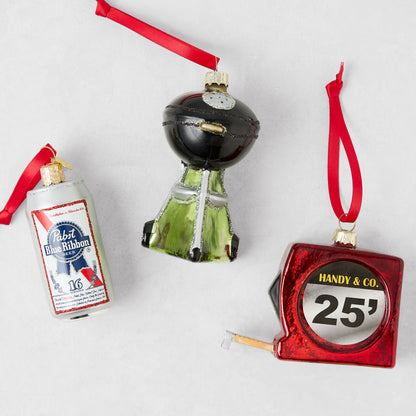 Glass ornament set featuring a PBR beer can, black grill, and red 25-foot measuring tape with red hanging ribbons.