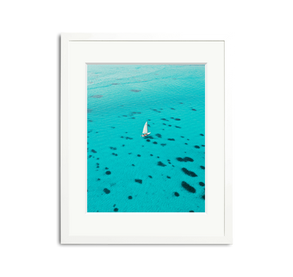 Dalmatian Pattern Framed Wall Art Print: White sailboat on turquoise water, white wooden frame, custom white mat.