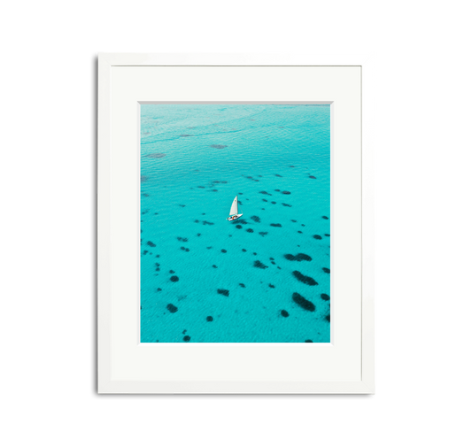 Dalmatian Pattern Framed Wall Art Print: White sailboat on turquoise water, white wooden frame, custom white mat.