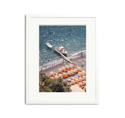 D'Arienzo II framed wall art print of a vibrant Italian beach with orange striped umbrellas and boats.