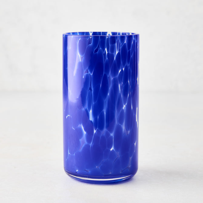 Dark blue spotted highball glass, 3.3"Dia x 5.7"H, with clear glass base.