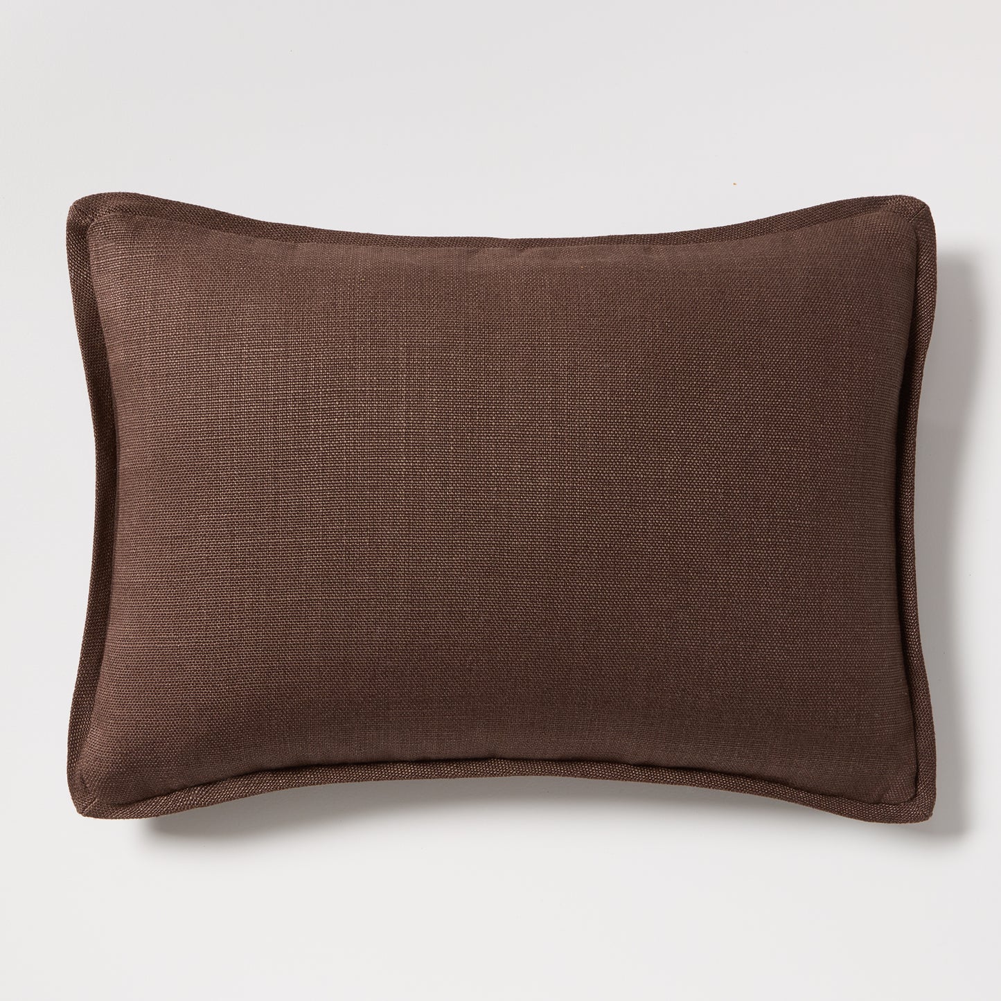 Dark brown tonal reversible velvet and linen lumbar pillow, 20x14 inches.