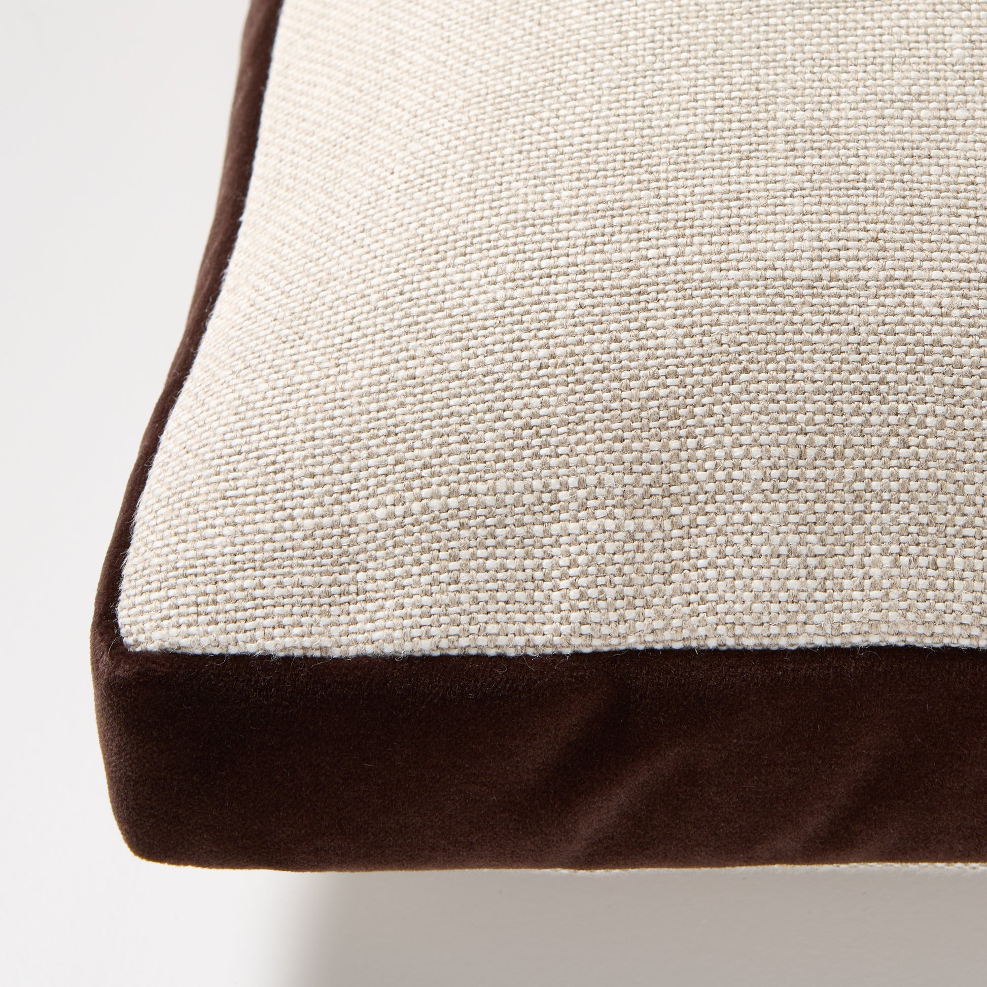 Dark brown velvet gusseted and flax linen lumbar pillow, 20"L x 14"H.