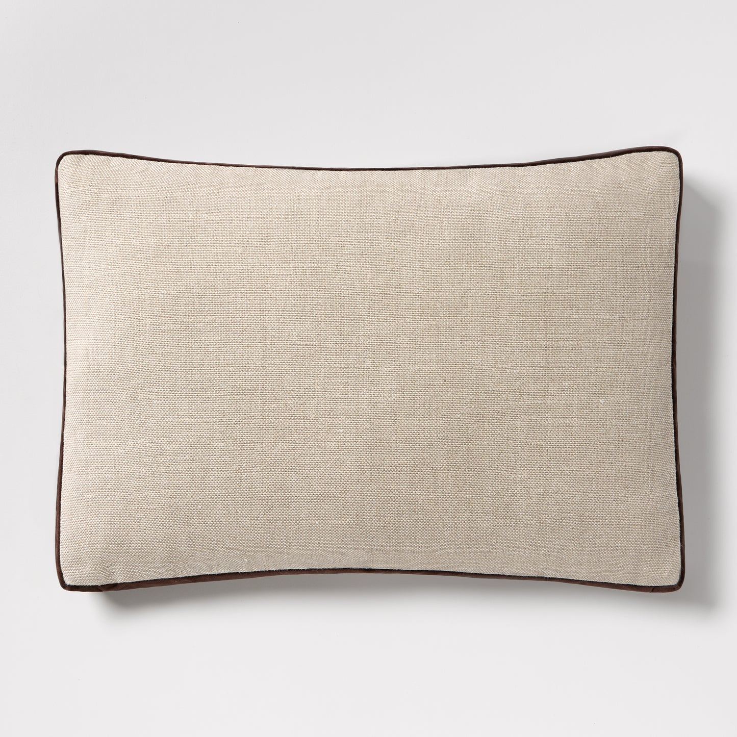 Dark brown velvet gusseted and linen lumbar pillow, 20"L x 14"H, with dark brown piping.