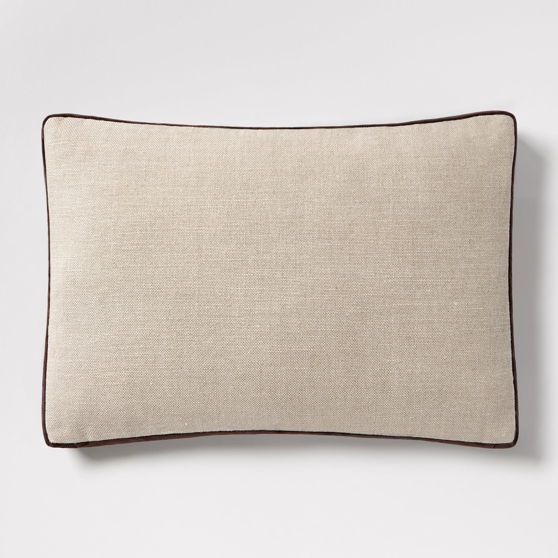 Dark brown velvet gusseted and linen lumbar pillow, 20"L x 14"H, with dark brown piping.