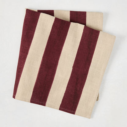 Dark Plum Hampton Stripe Natural Cotton Napkin, folded, with wide dark purple stripes on a khaki base.