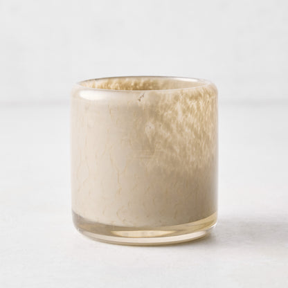 Small dark taupe mouth-blown glass votive candle holder, 2.75 inches tall with a textured, translucent finish.