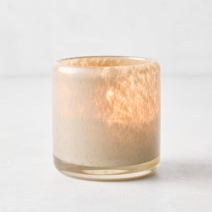 Small mouth-blown dark taupe glass votive candle holder with a textured finish, 2.75 inches tall.