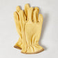 Medium yellow deerskin gardening gloves with a subtle texture and brown cuff trim.