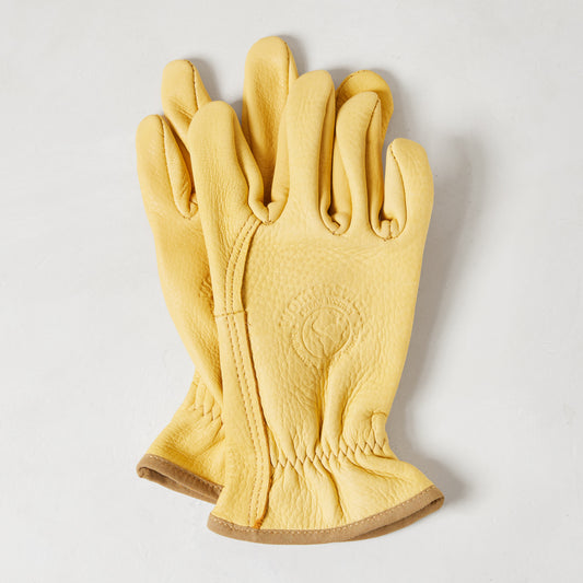 Medium yellow deerskin gardening gloves with a subtle texture and brown cuff trim.