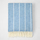 Denim Blue Fiji Stripe Throw Blanket, 51"x67" cotton-acrylic, with white vertical stripes and fringe.