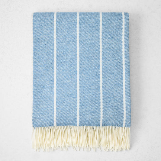 Denim Blue Fiji Stripe Throw Blanket, 51"x67" cotton-acrylic, with white vertical stripes and fringe.