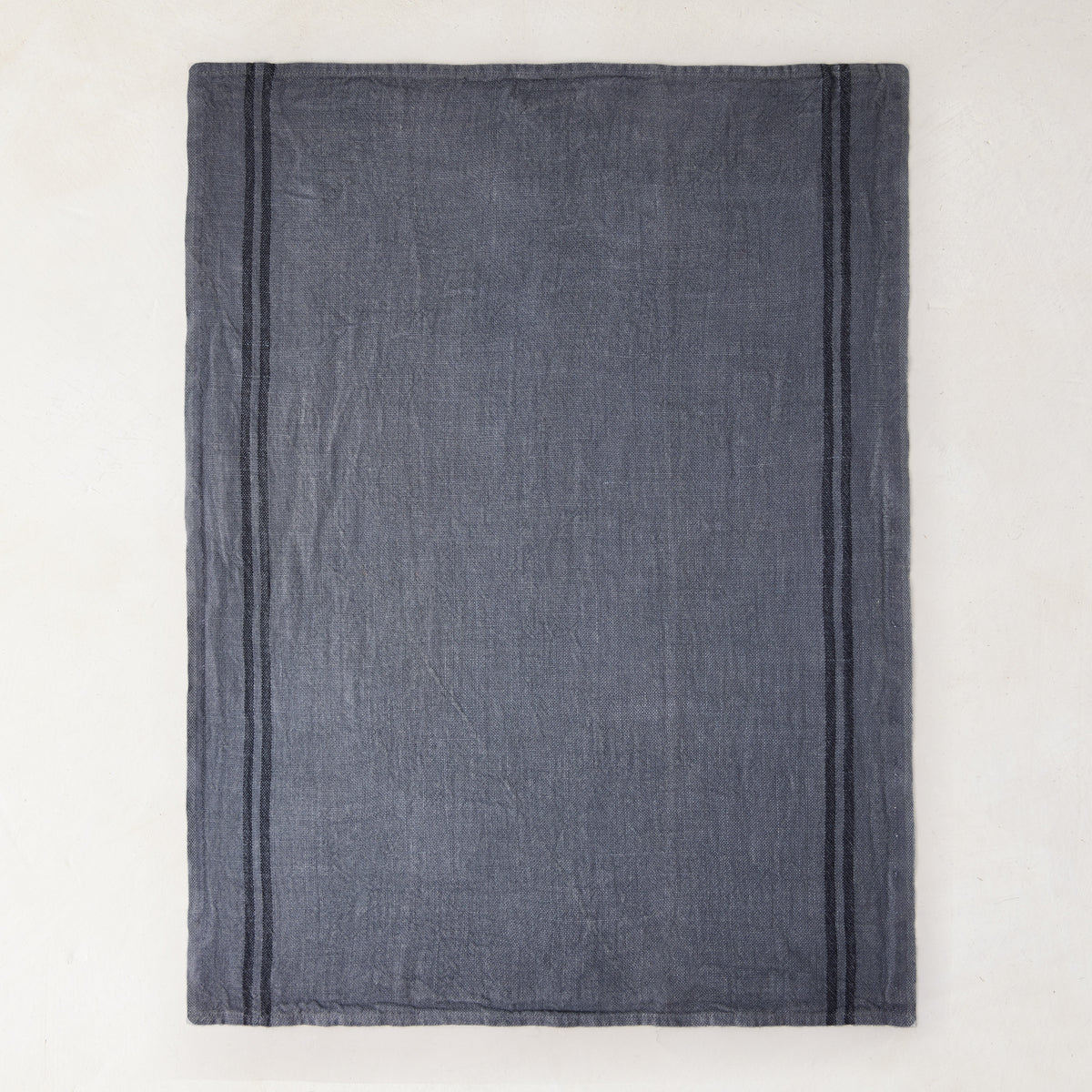 Denim blue striped linen tea towel, set of 2, with two dark vertical stripes.