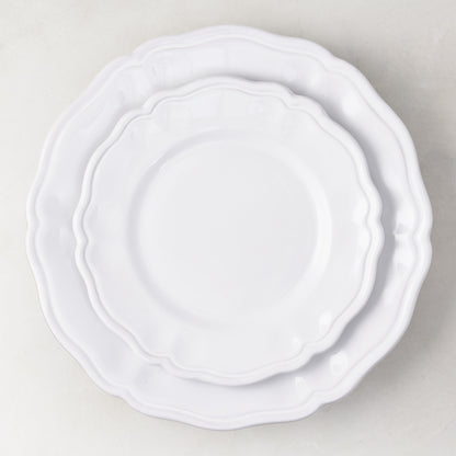 Handmade white ceramic dinner plate with scalloped edges, 11-inch diameter, Italian-style painted finish.