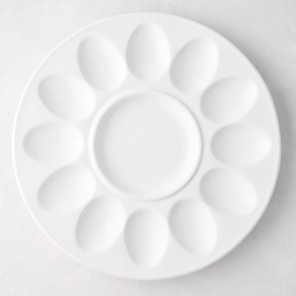 White ceramic Deviled Egg Serving Platter, 11"Dia, with 12 egg indentations and a center dip well.
