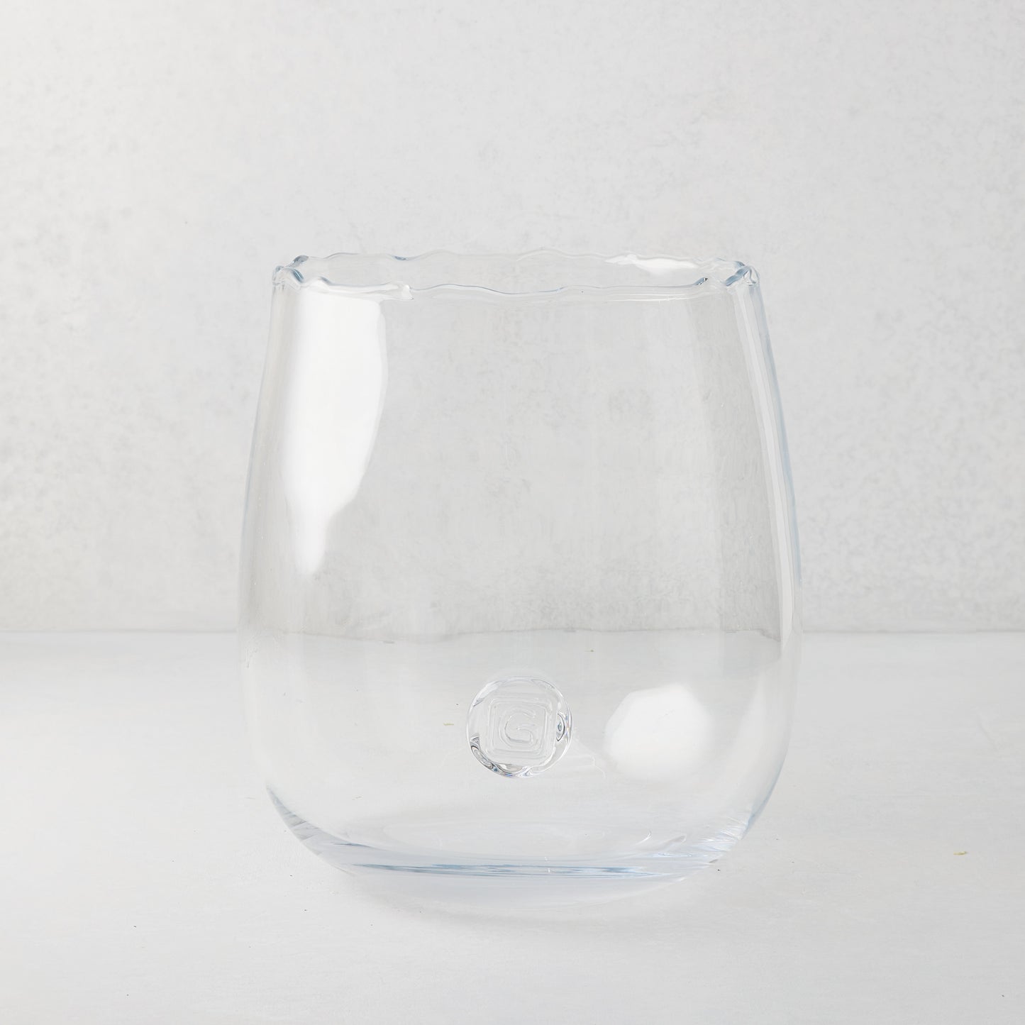 Clear, large Diana Scissor-Cut Vase with a rounded base and subtle scissor-cut edge.