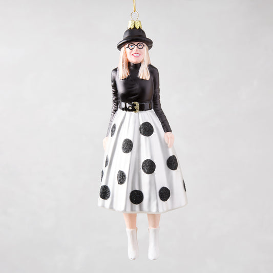 Diane Keaton Christmas tree ornament, black hat, glasses, black top, white polka dot skirt, white boots.