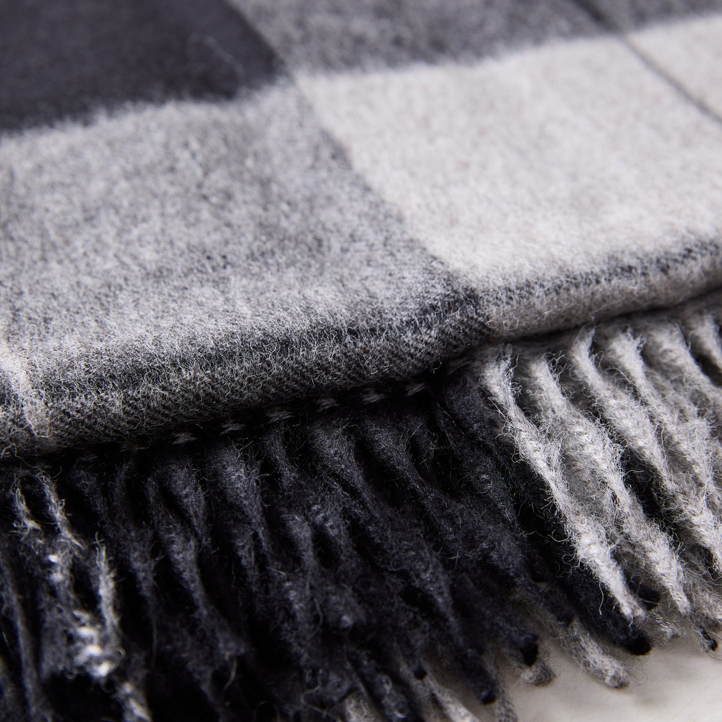 Diane Keaton + Hudson Grace charcoal plaid baby alpaca throw blanket with fringe.