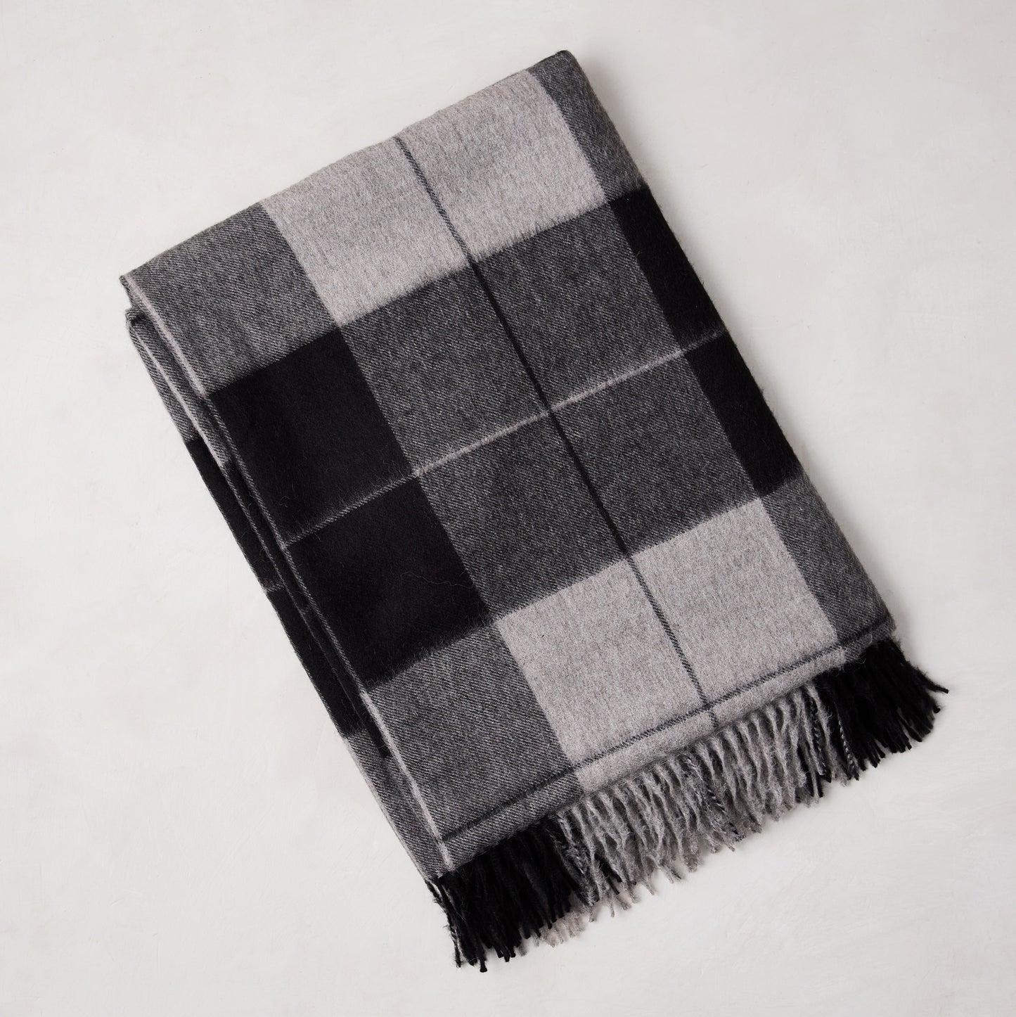 Diane Keaton x Hudson Grace charcoal plaid baby alpaca throw blanket with fringe.