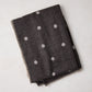 Diane Keaton + Hudson Grace grey baby alpaca polka dot throw blanket with stitched edge.