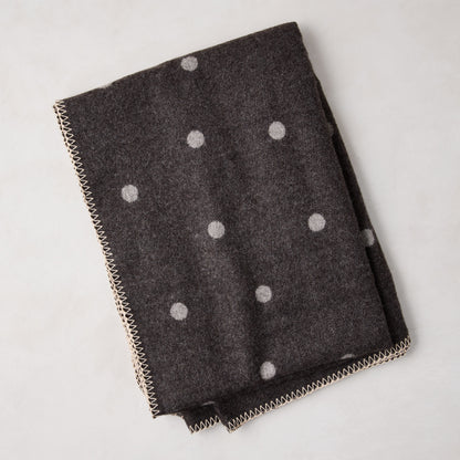 Diane Keaton + Hudson Grace grey baby alpaca polka dot throw blanket with stitched edge.