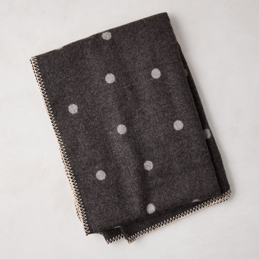 Diane Keaton + Hudson Grace grey baby alpaca polka dot throw blanket with stitched edge.