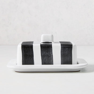 Diane Keaton + Hudson Grace white stoneware butter dish with hand-painted black stripes and lid handle.