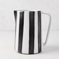 Diane Keaton + Hudson Grace black and white striped ceramic pitcher with geometric handle.