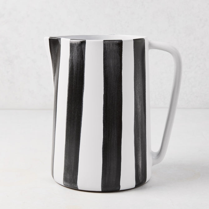 Diane Keaton + Hudson Grace black and white striped ceramic pitcher with geometric handle.