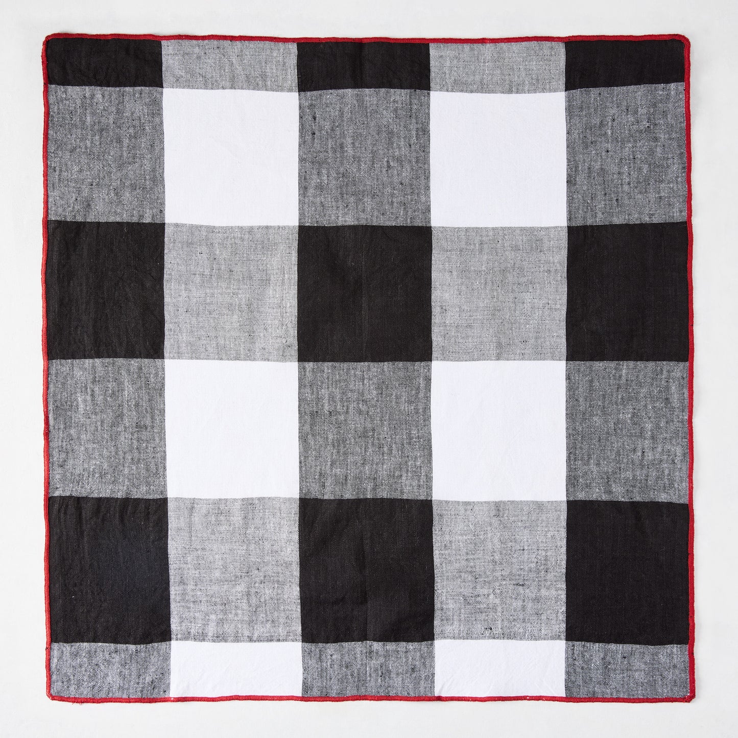 Diane Keaton + Hudson Grace black buffalo check napkin with red border, cotton linen blend.