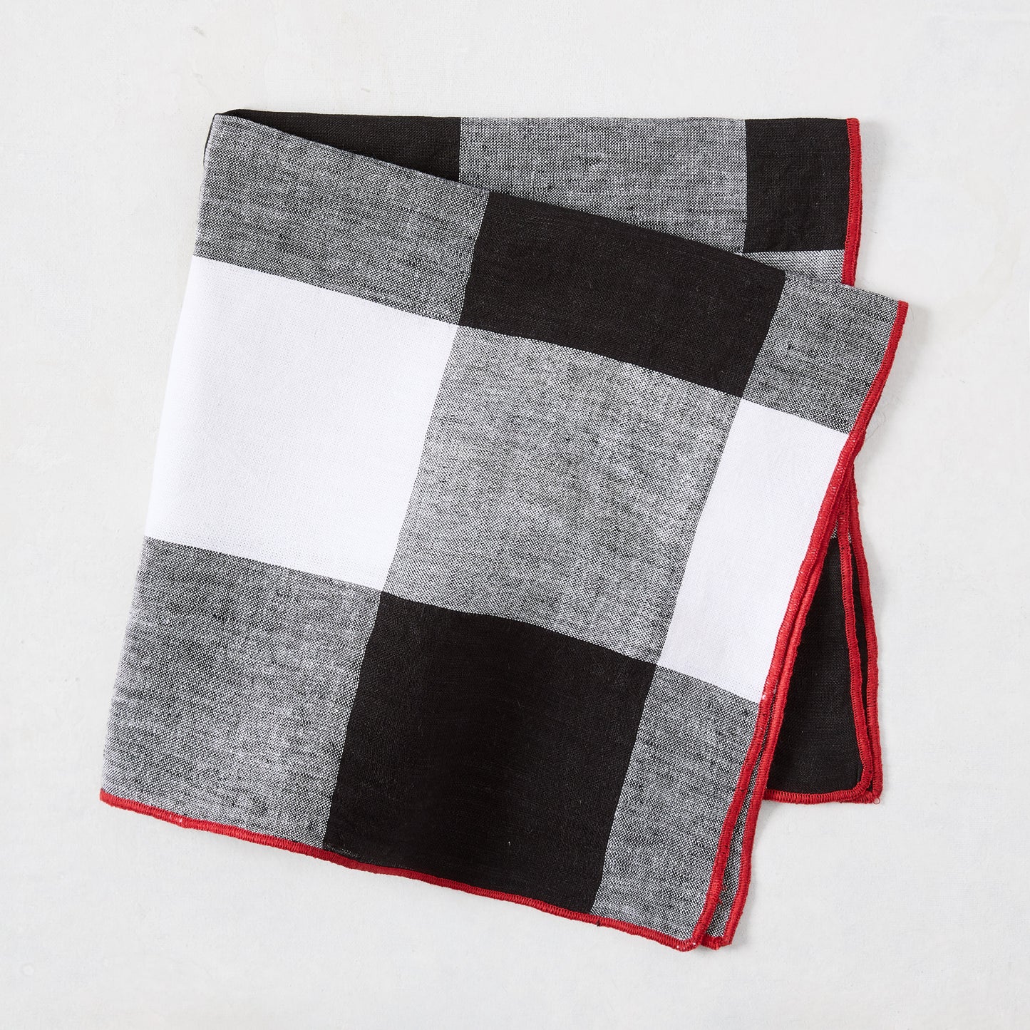 Diane Keaton + Hudson Grace black buffalo check cotton linen napkin with red border.