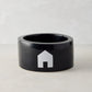 Diane Keaton + Hudson Grace black Italian ceramic dog bowl with white house icon.