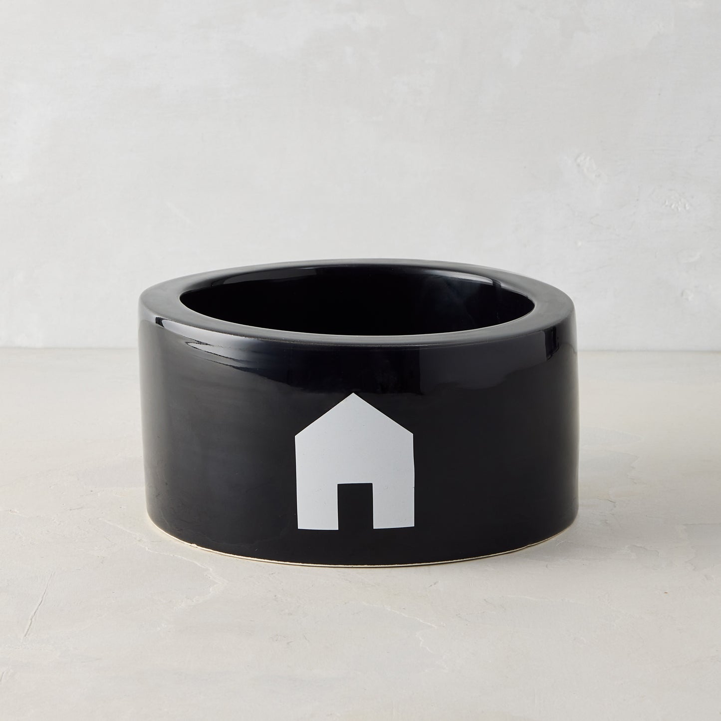 Diane Keaton + Hudson Grace black Italian ceramic dog bowl with white house icon.