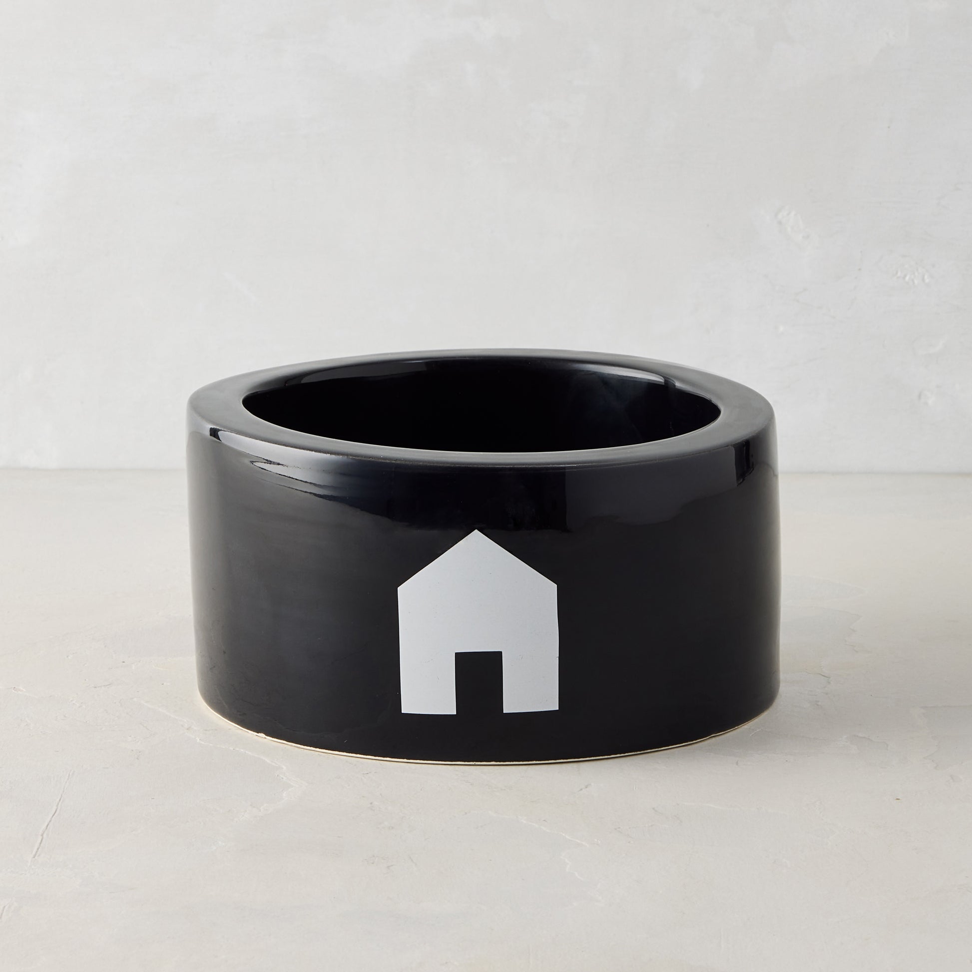 Diane Keaton + Hudson Grace black Italian ceramic dog bowl with white house icon.