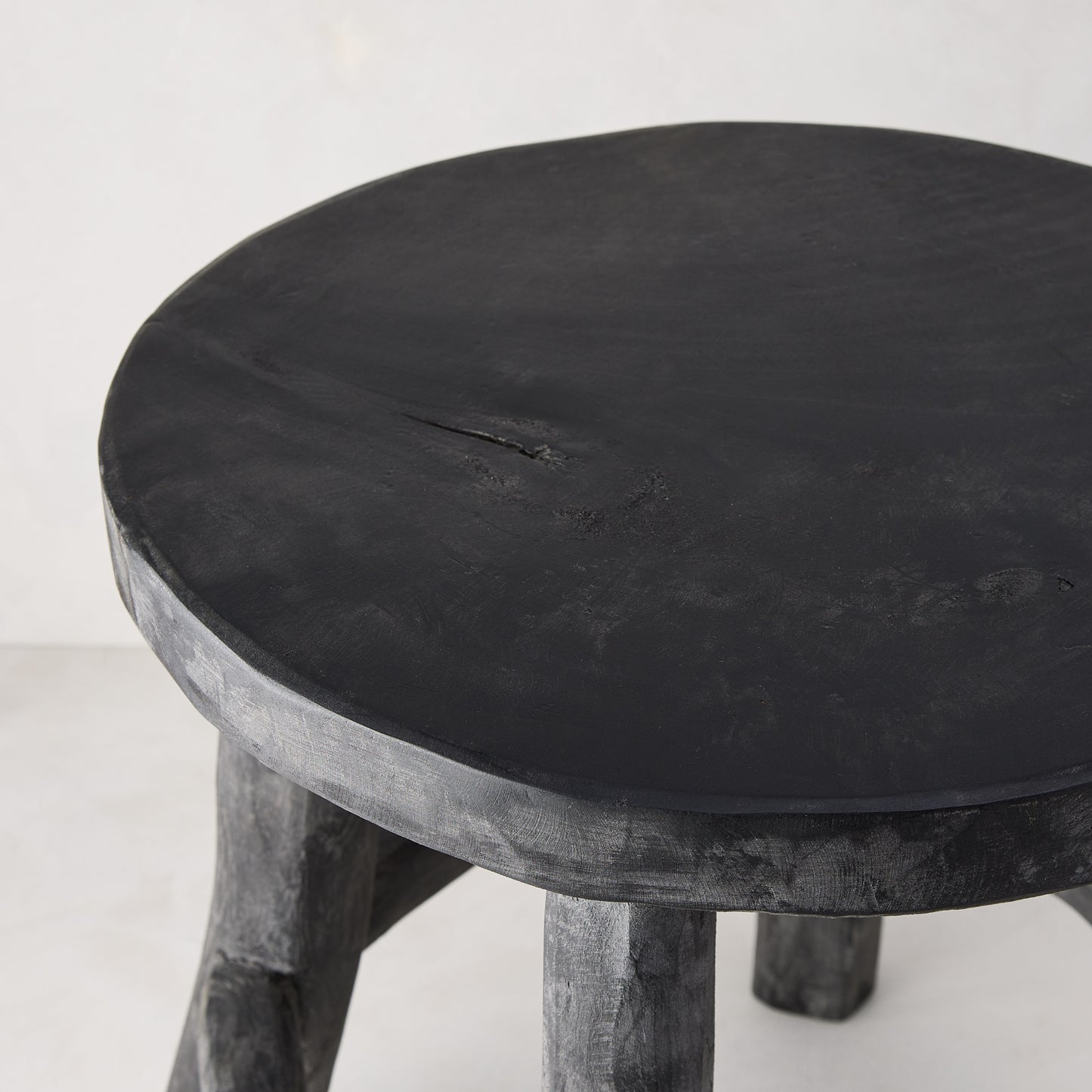 Diane Keaton + Hudson Grace black reclaimed teak wood stool with rustic texture.