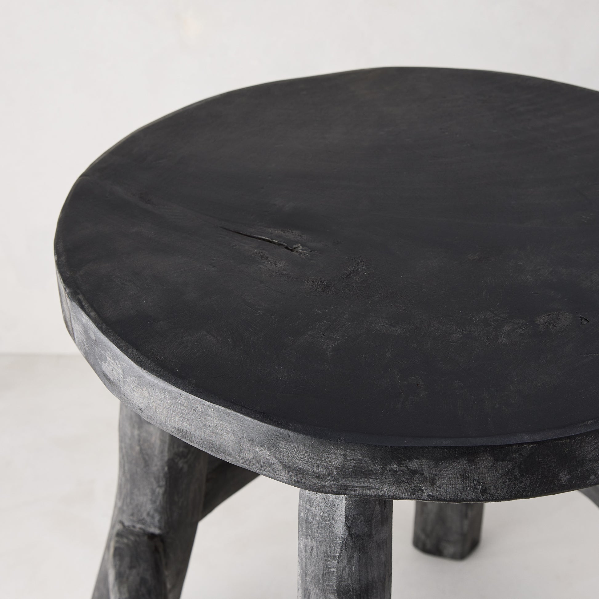 Diane Keaton + Hudson Grace black reclaimed teak wood stool with rustic texture.
