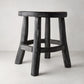 Diane Keaton + Hudson Grace black reclaimed teak wood stool with rustic texture.