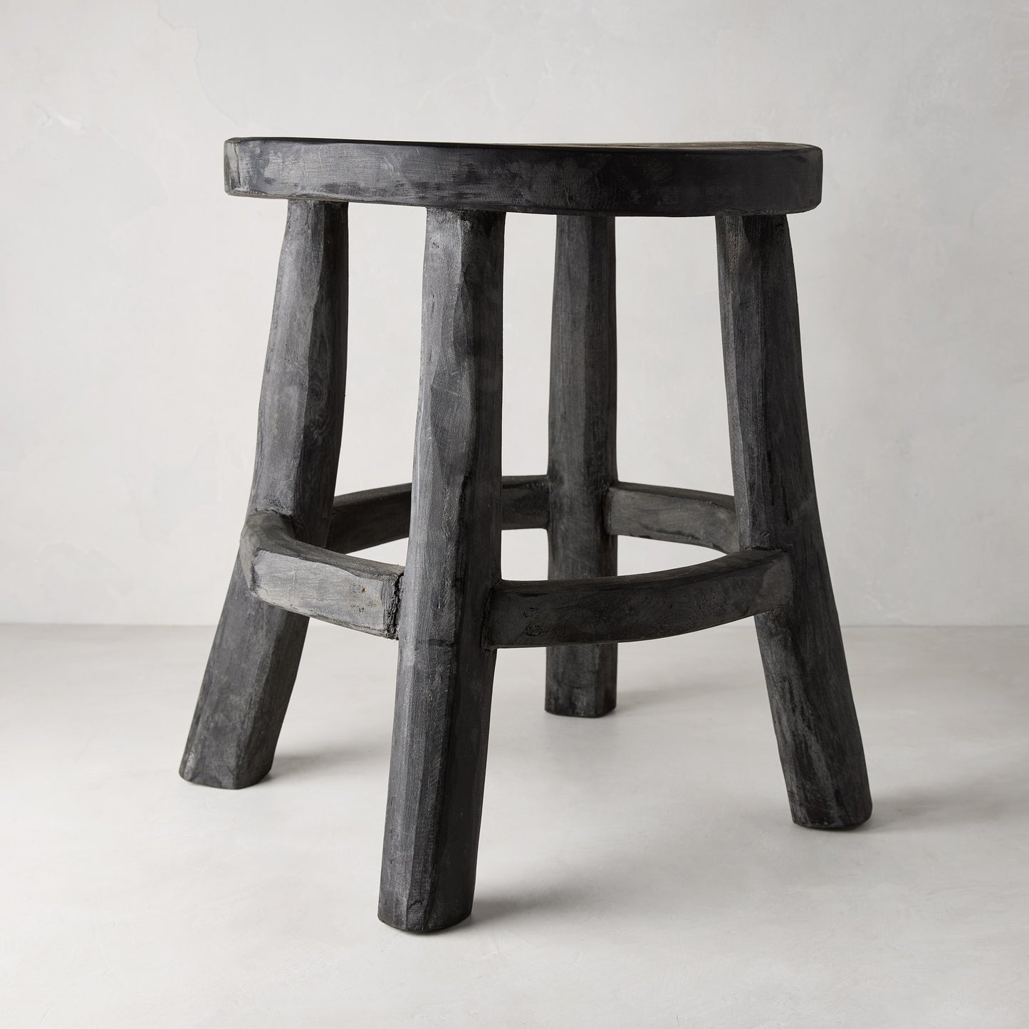 Diane Keaton + Hudson Grace black reclaimed teak wood stool with rustic texture.