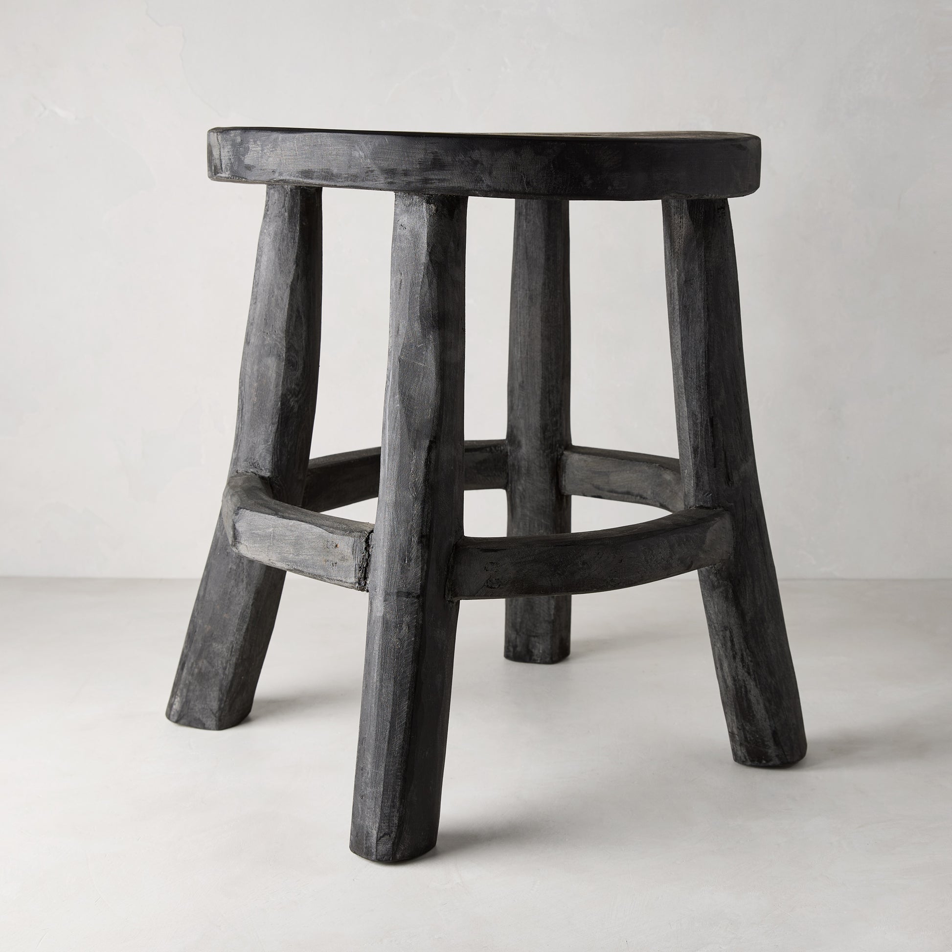 Diane Keaton + Hudson Grace black reclaimed teak wood stool with rustic texture.