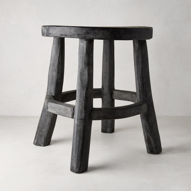 Diane Keaton + Hudson Grace black reclaimed teak wood stool with rustic texture.