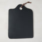 Diane Keaton + Hudson Grace black stone cheese board with leather handle.