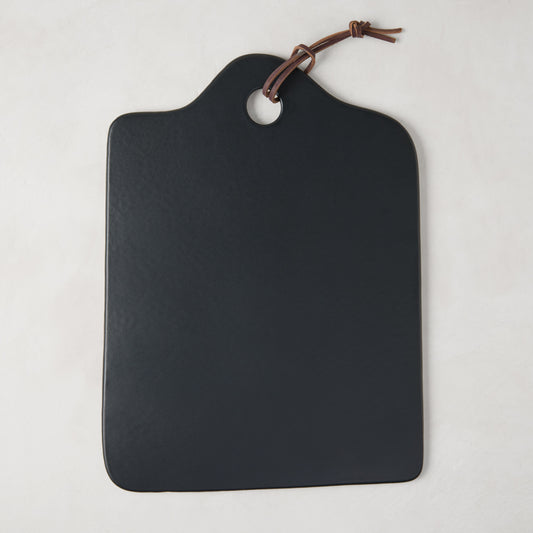 Diane Keaton + Hudson Grace black stone cheese board with leather handle.
