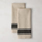 Set of 2 Diane Keaton + Hudson Grace black striped khaki cotton-linen blend hand towels.