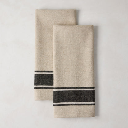 Set of 2 Diane Keaton + Hudson Grace black striped khaki cotton-linen blend hand towels.