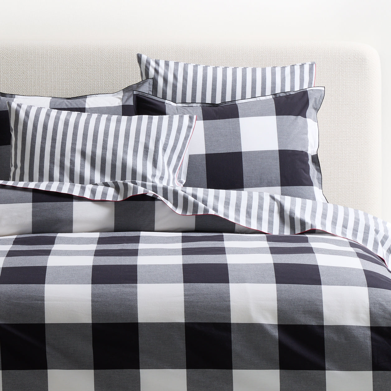 Diane Keaton + Hudson Grace black and white buffalo check percale duvet and shams with red piping.