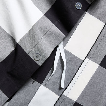 Diane Keaton + Hudson Grace black and white buffalo check percale duvet cover with button closure.