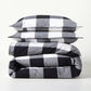Diane Keaton + Hudson Grace black and white buffalo check percale duvet and shams set, folded.