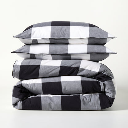 Diane Keaton + Hudson Grace black and white buffalo check percale duvet and shams set, folded.