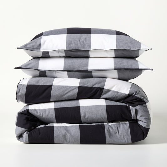 Diane Keaton + Hudson Grace black and white buffalo check percale duvet and shams set, folded.